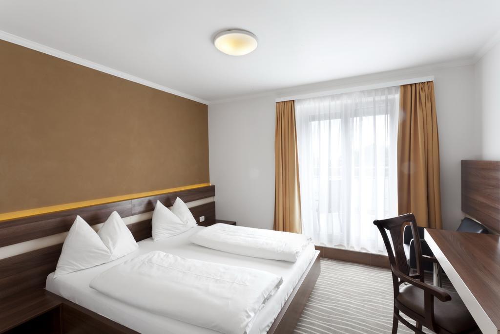 Primus Hotel & Apartments Viena Quarto foto